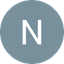 White letter N centered on a muted blue-gray circle with black background.