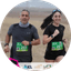 Two runners with bibs 260 and 261 participating in a desert marathon event.