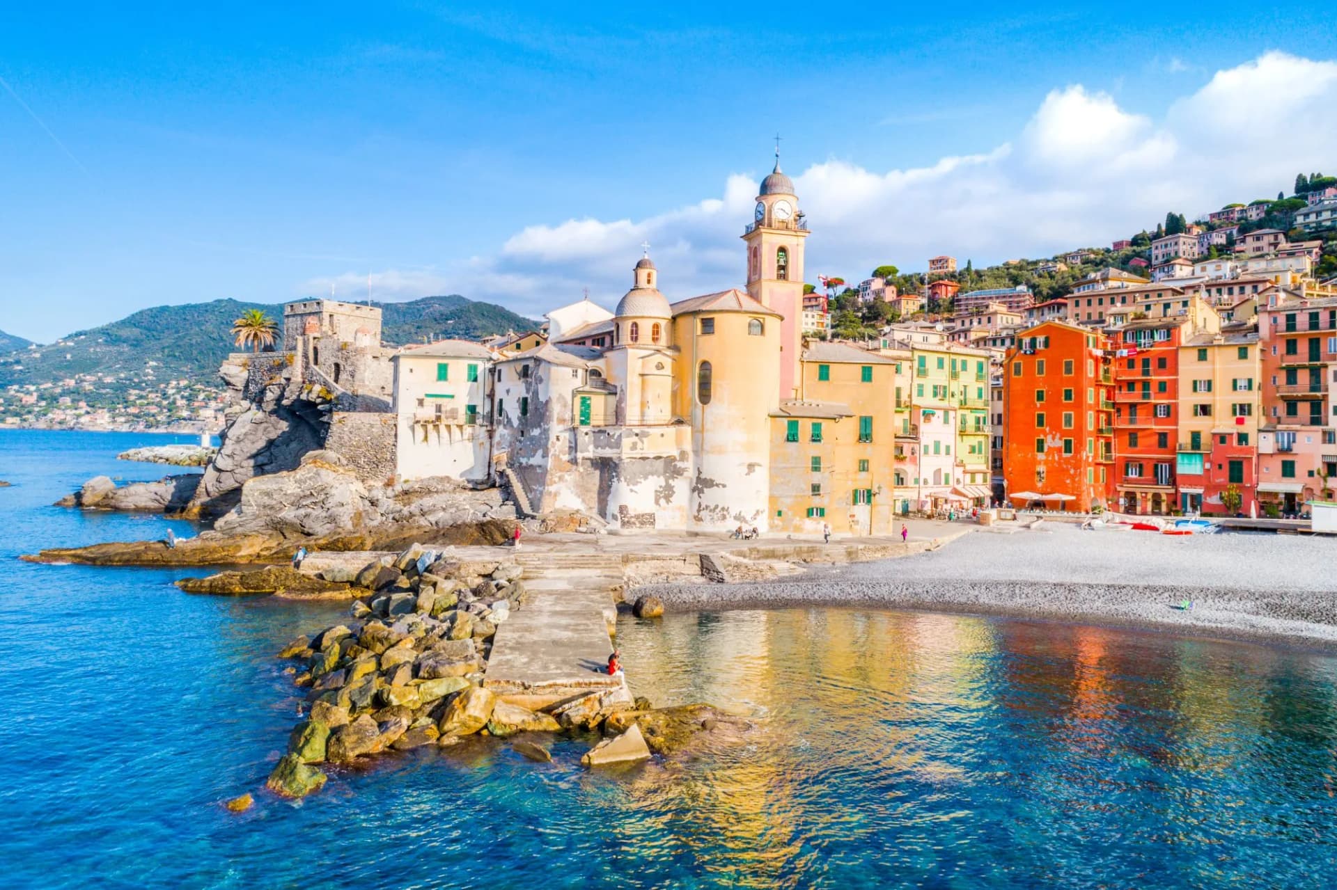 Scenic Mediterranean riviera coast. Panoramic view of Camogli town in Liguria, Italy. Basilica of Santa Maria Assunta and colorful palaces. Italy