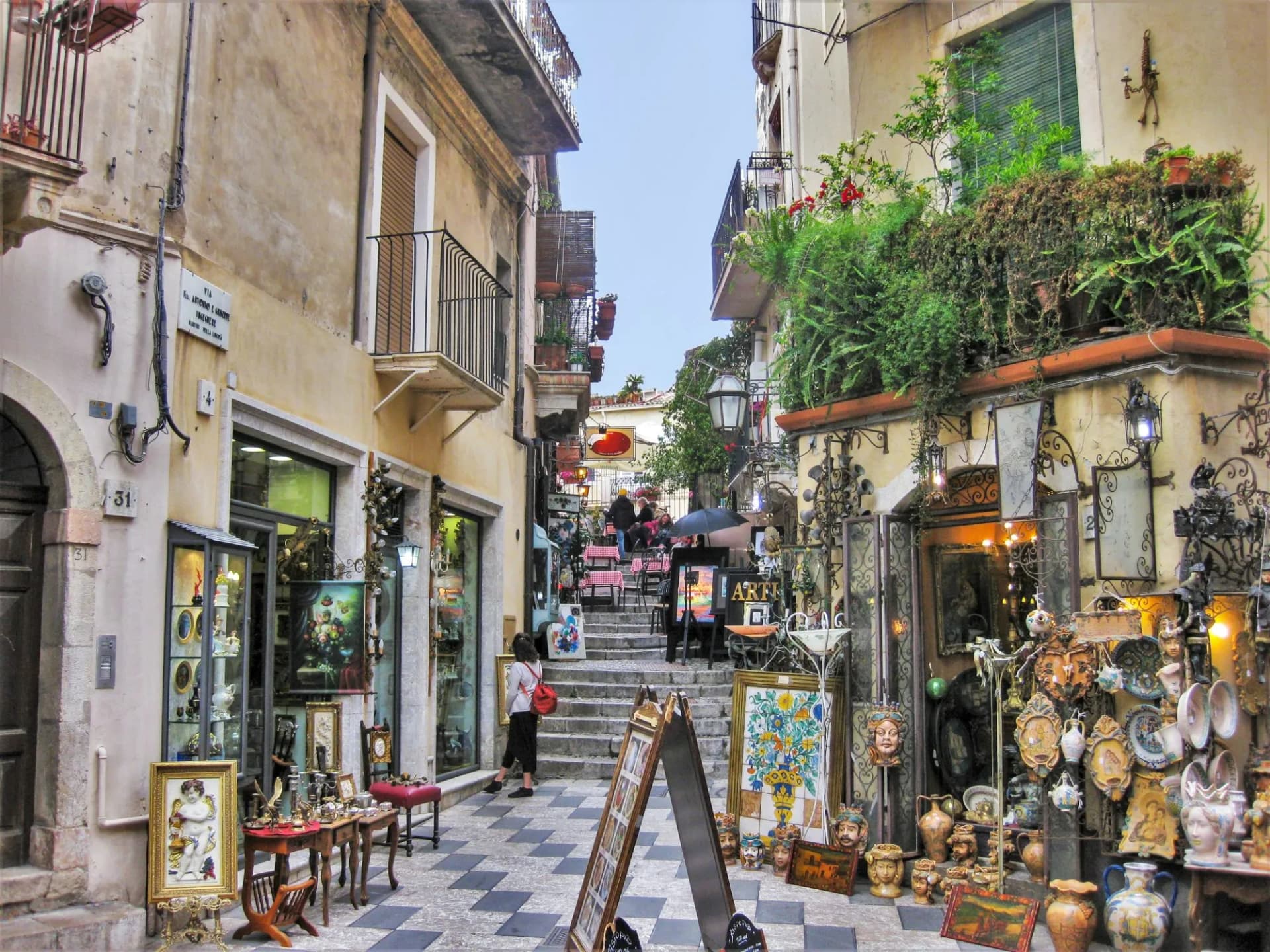 A colorful Street in the medieval town of Taormina, Italy.