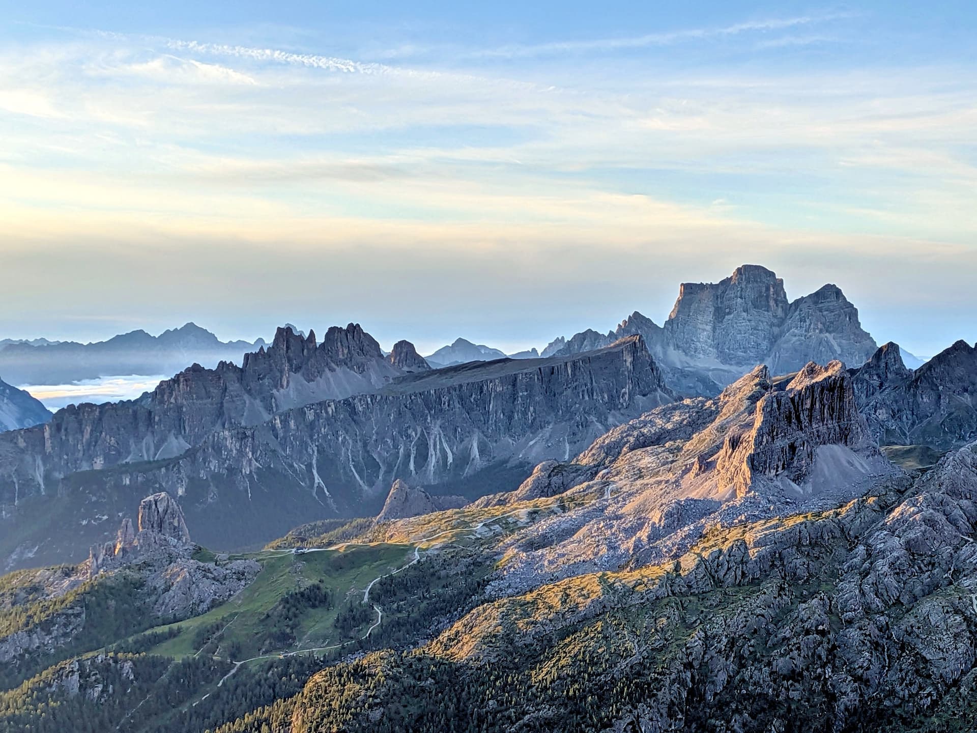 Jagged Dolomite mountain ridges at dawn with morning light illuminating rocky peaks