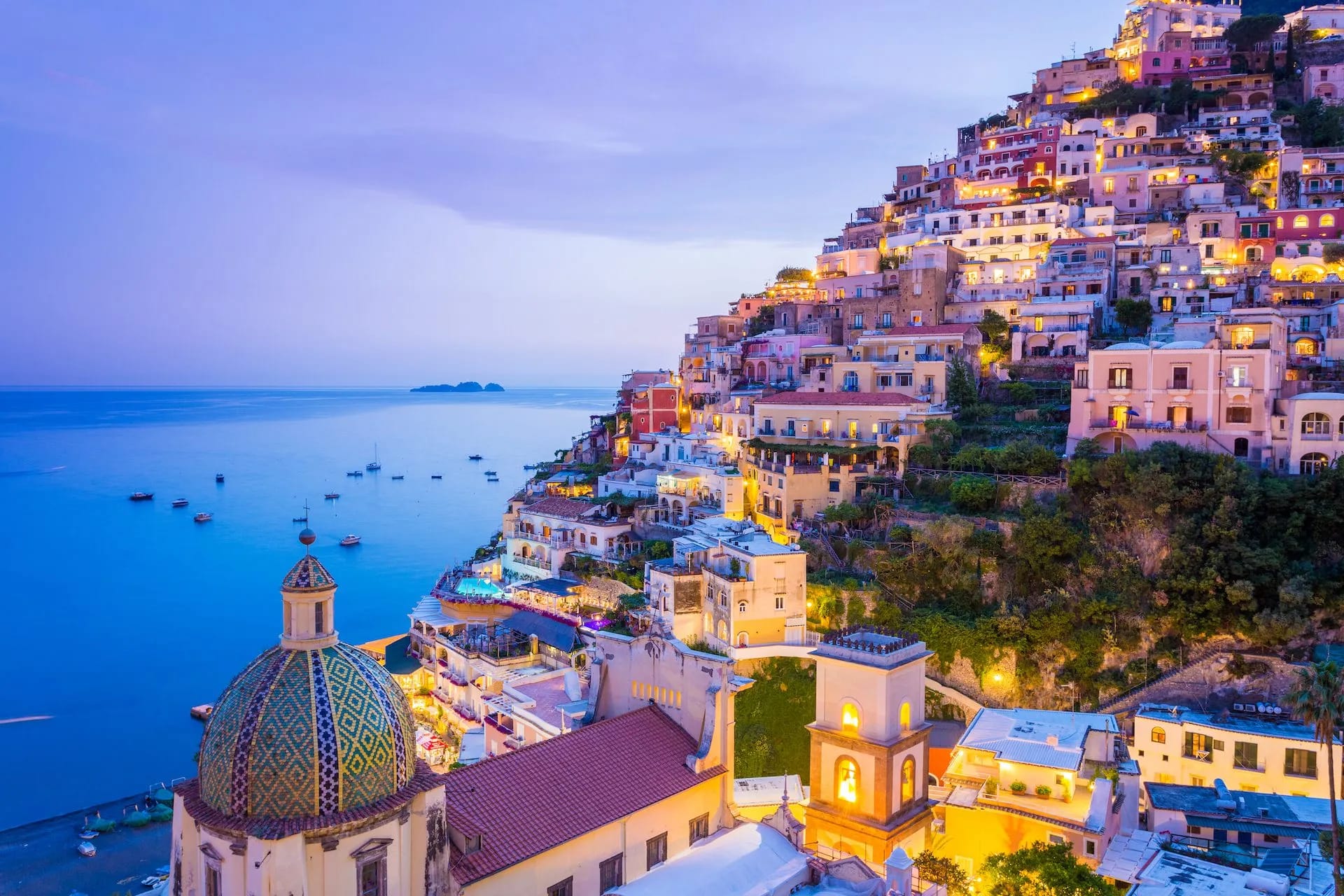 View of the Postiano town and the seaside in a summer sunset.