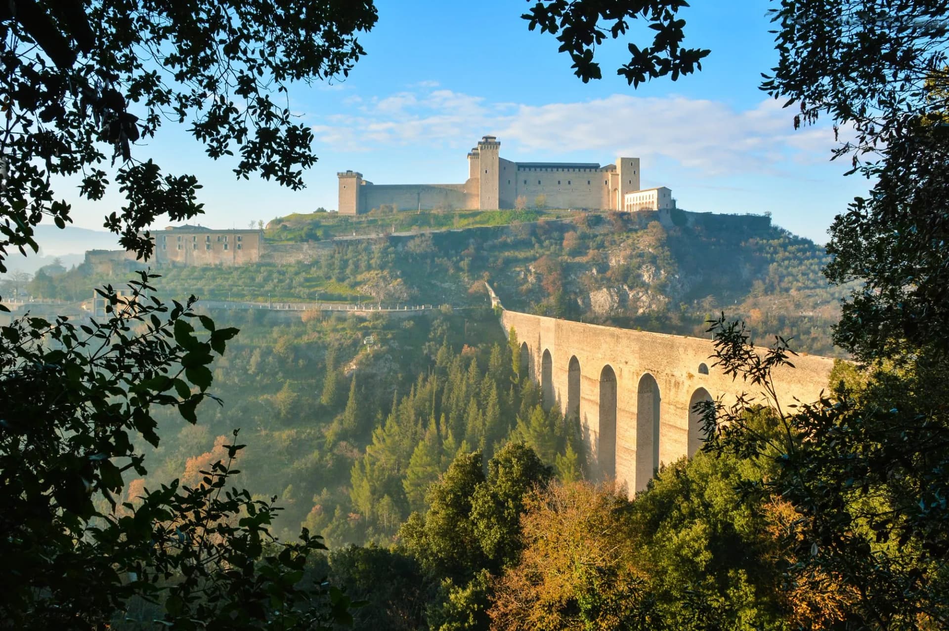 Spoleto (Italy) - A misty fall day in the charming medieval village in Umbria region. The soft focus depends on dense fog, which, however, creates an evocative atmosphere with Sun rays